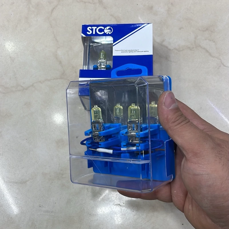 لامپ خودرو 100 وات برندSTCO رنگ زرد پایهh3 در بسته بندی 2 عددی